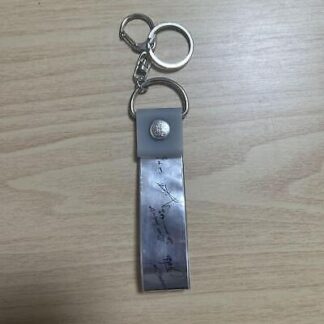 XG Silver Tape Key Chain Signed By Members